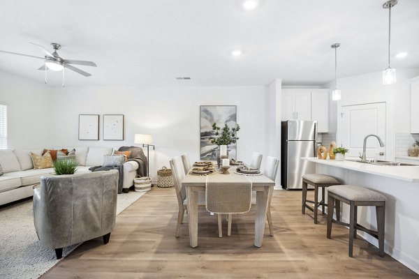 Dining room featuring modern decor and elegant lighting in River Rock at Shingletree Apartments