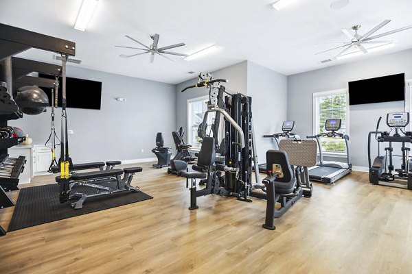 Modern fitness center with state-of-the-art equipment at River Rock at Shingletree Apartments