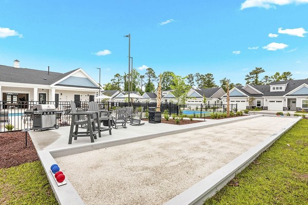 Spacious recreational area with lounge seating and games at River Rock at Shingletree Apartments, perfect for relaxation and socializing