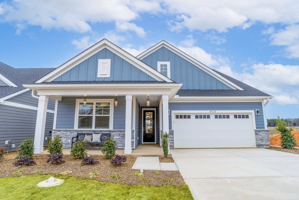building/exterior at River Rock at Alexander Farms (The Village) Apartment Townhomes