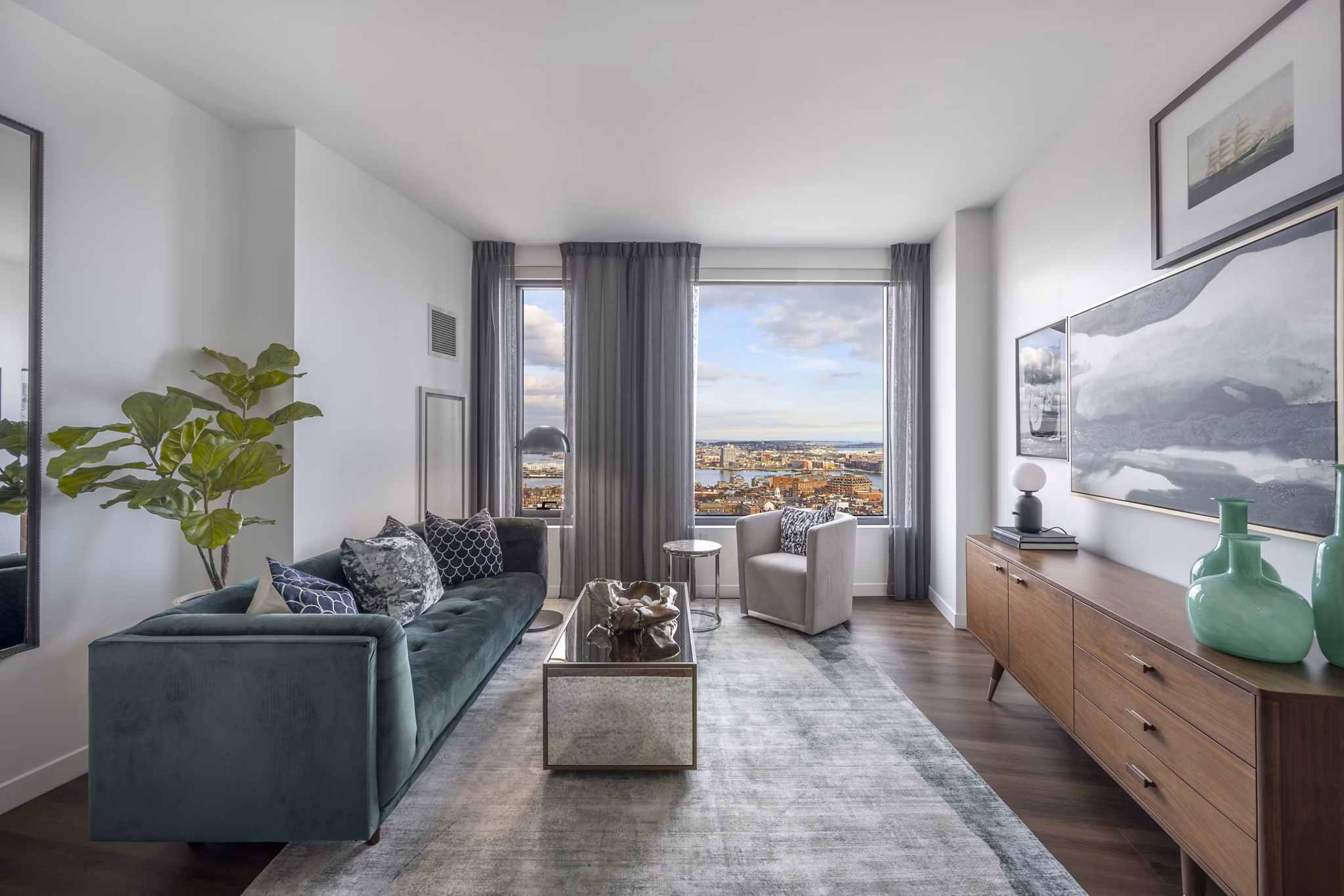 Living room with designer furnishings and large windows at The Sudbury Apartments, luxury living in the heart of the city