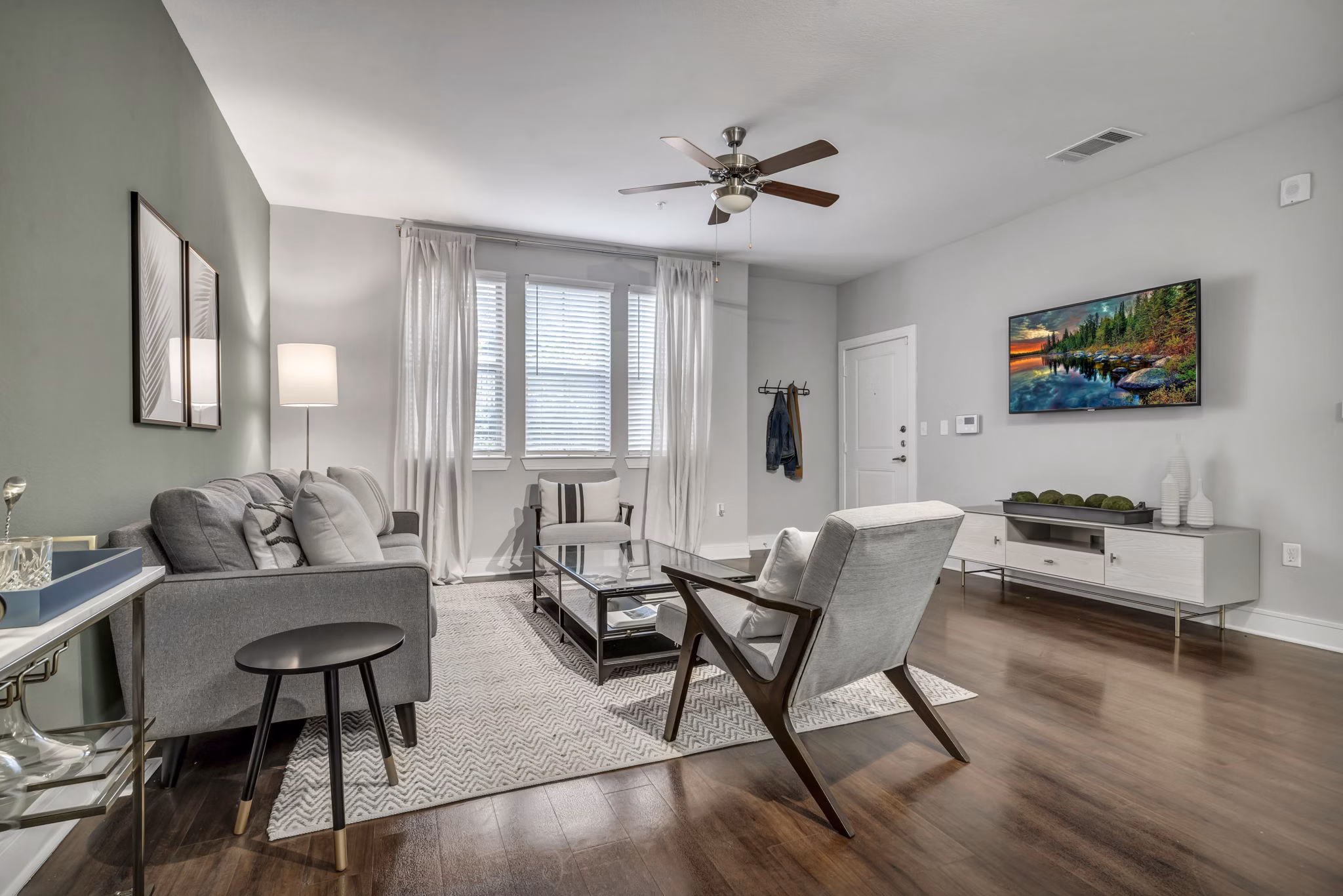 Open-concept living room with stylish decor at Axis Kessler Park Apartments, perfect for luxury living in a vibrant community