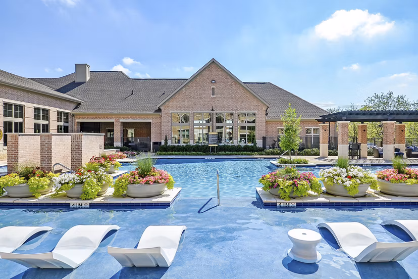 Relaxing pool area with modern loungers at Axis Kessler Park Apartments