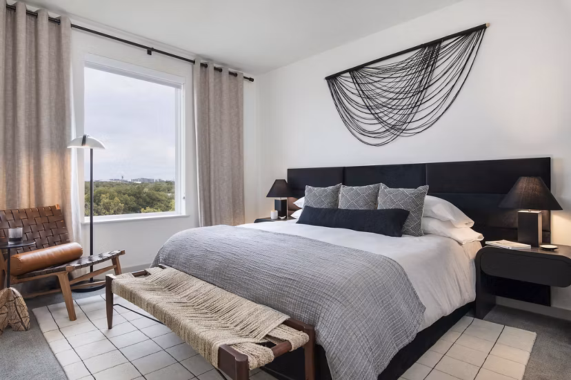 Cozy bedroom with modern furnishings at Starlight Apartments