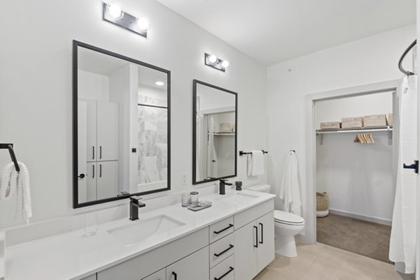 Bathroom featuring sleek fixtures and modern design in Starlight Apartments