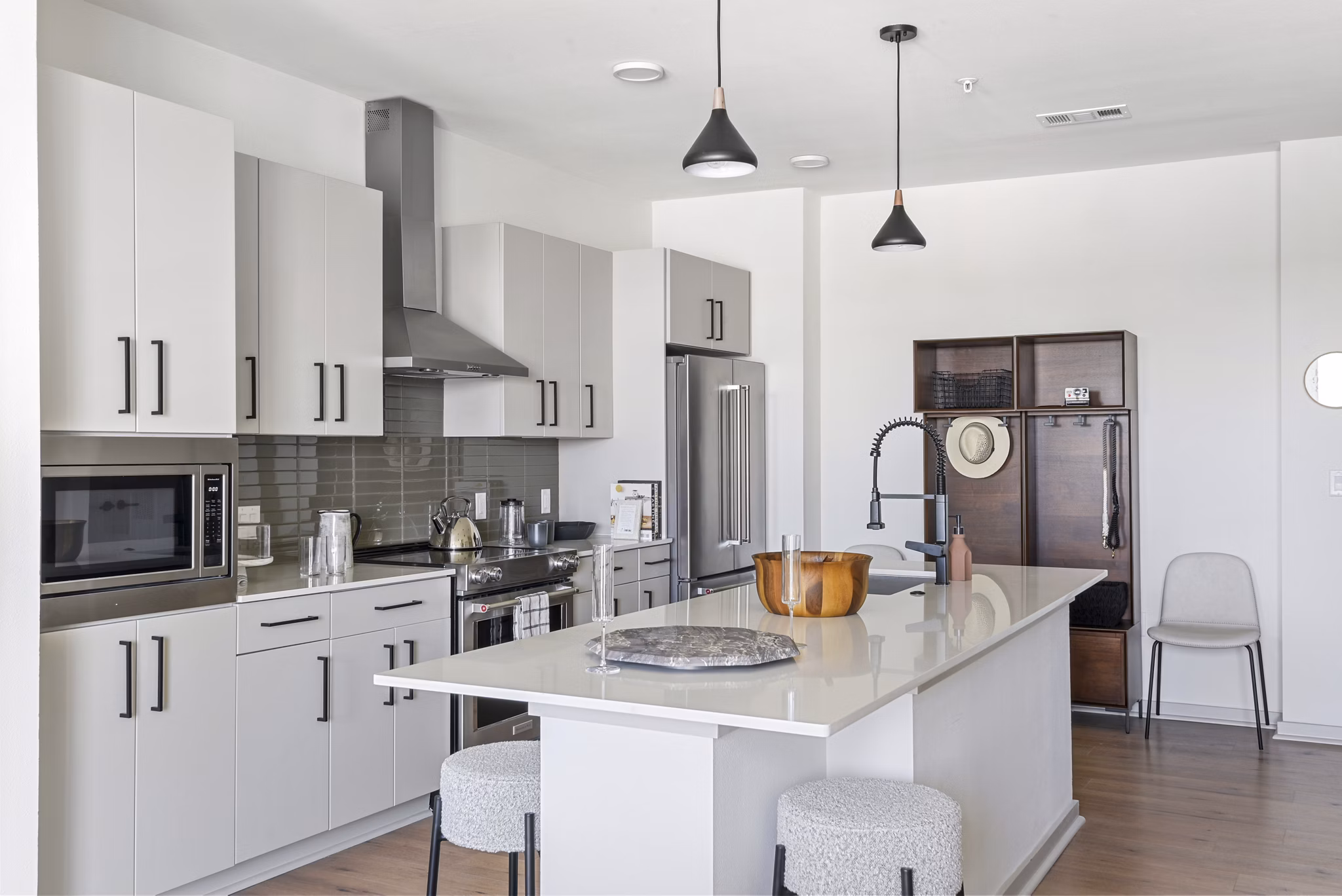 Modern kitchen featuring stainless steel appliances in Starlight Apartments