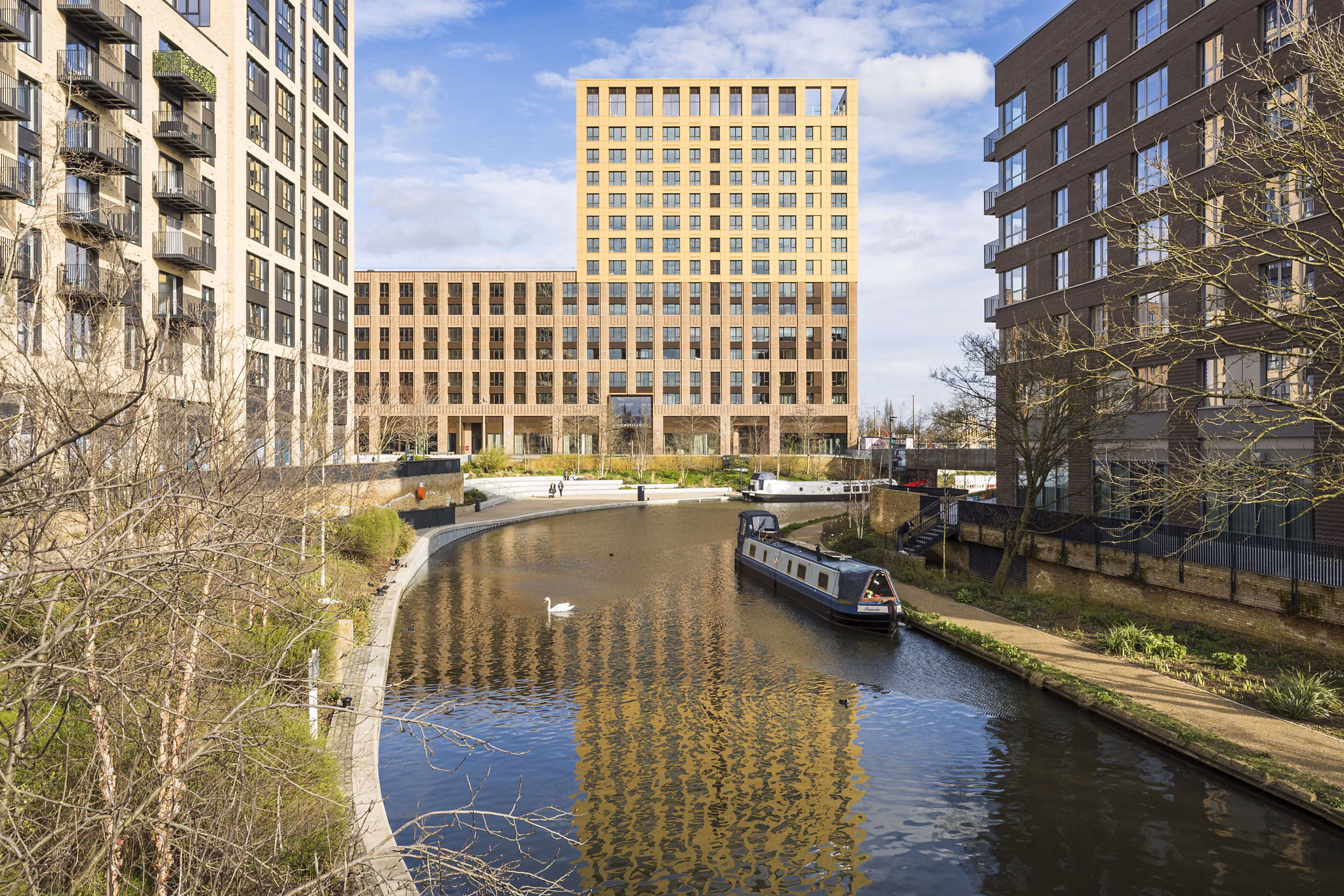 Exterior view of Greenford Quay Glassworks building with canal-side scenery and contemporary architectural design.