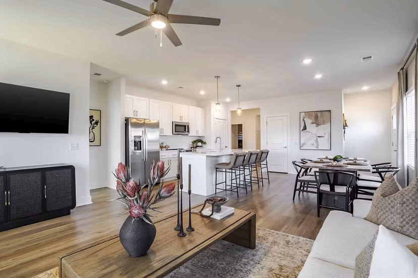 Living room featuring cozy seating and modern decor at River Rock at Blume Road Apartment Homes