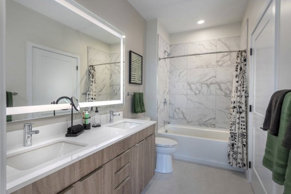 Sleek bathroom with modern fixtures at Matson Mill Apartments, offering luxury living by Greystar in a prime location