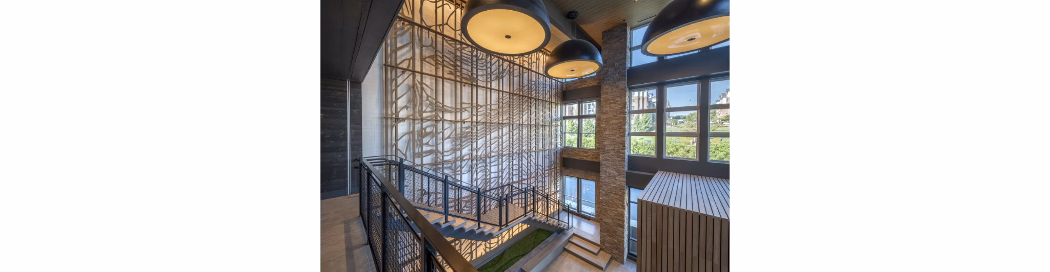 Clubhouse with modern furniture and large windows at Matson Mill Apartments, offering stylish amenities for residents