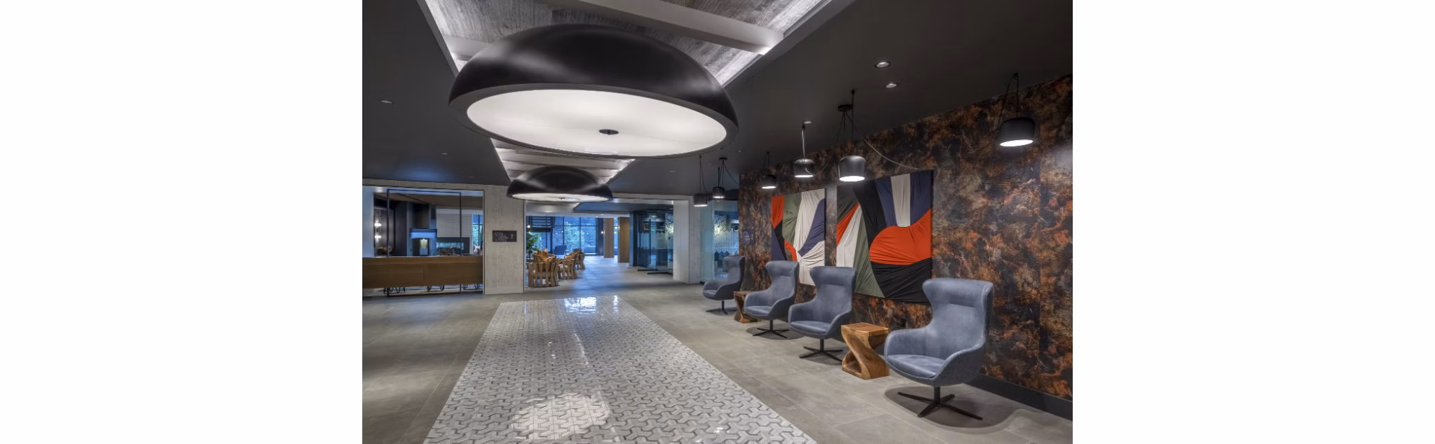 Modern clubhouse with stylish interior and communal seating at Matson Mill Apartments, ideal for social gatherings and events