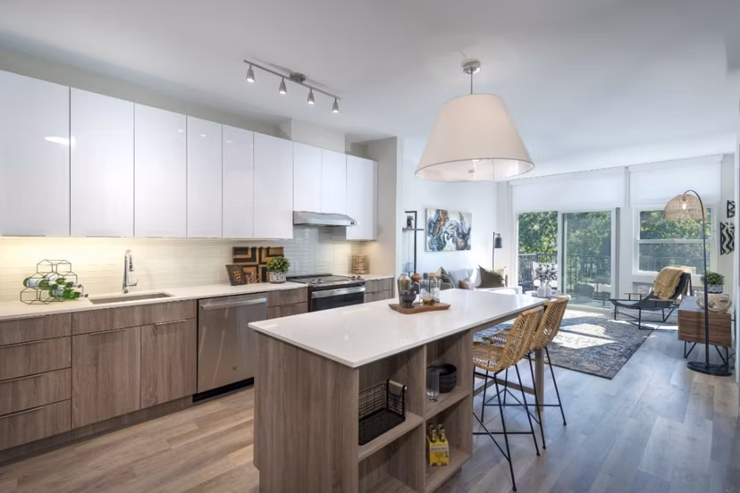 Modern kitchen with stainless steel appliances in Matson Mill Apartments