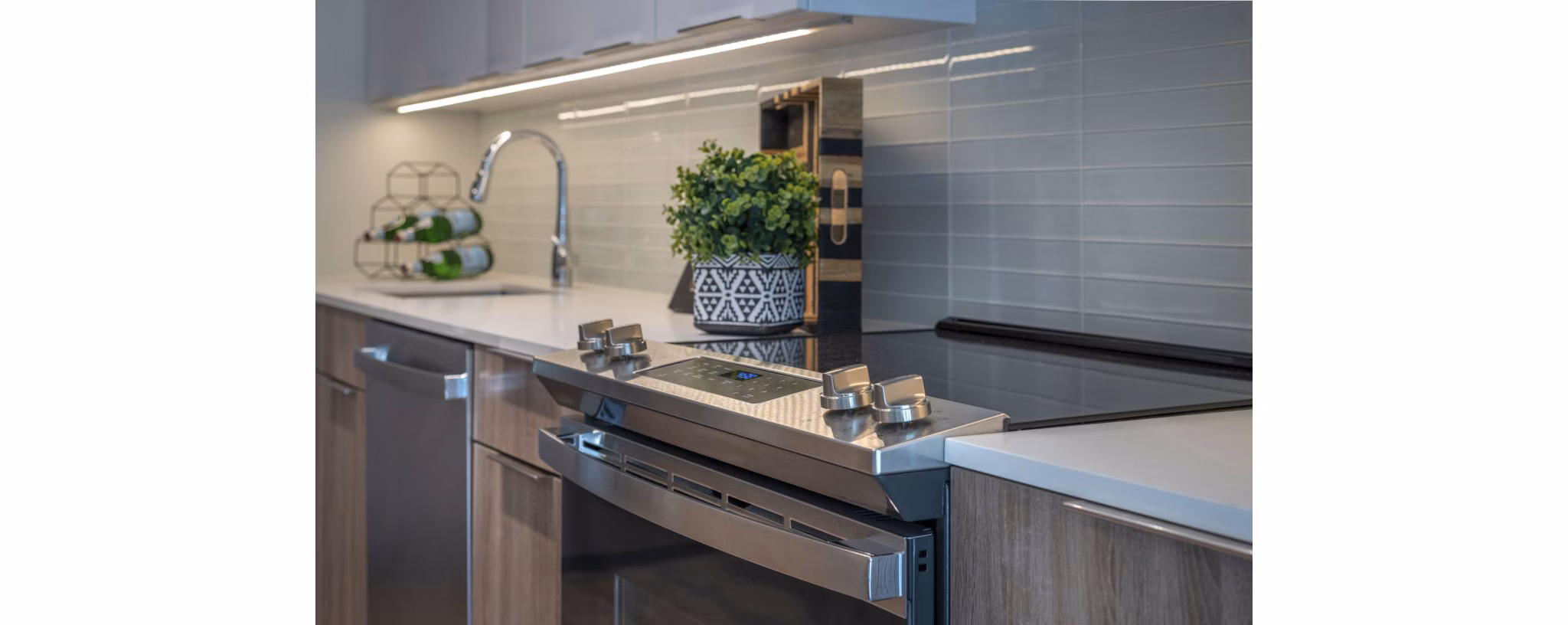 Modern kitchen with stainless steel appliances at Matson Mill Apartments