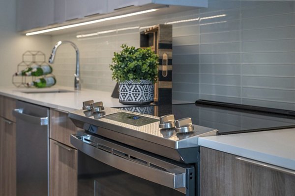 Modern kitchen with stainless steel appliances at Matson Mill Apartments