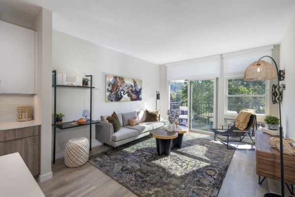 Spacious living room with modern furnishings at Matson Mill Apartments, offering luxury accommodations near Greystar properties