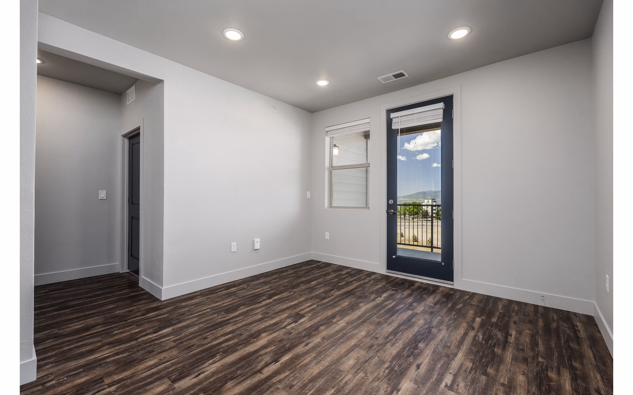 The Flats at Aero Park Apartments: Modern bedroom with stylish decor and natural light