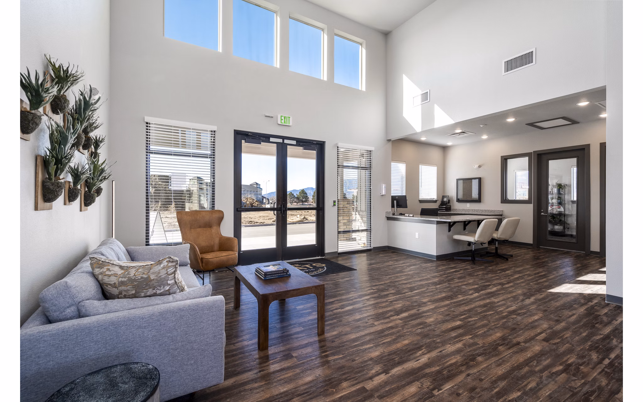 Clubhouse with modern design and cozy seating at The Flats at Aero Park Apartments