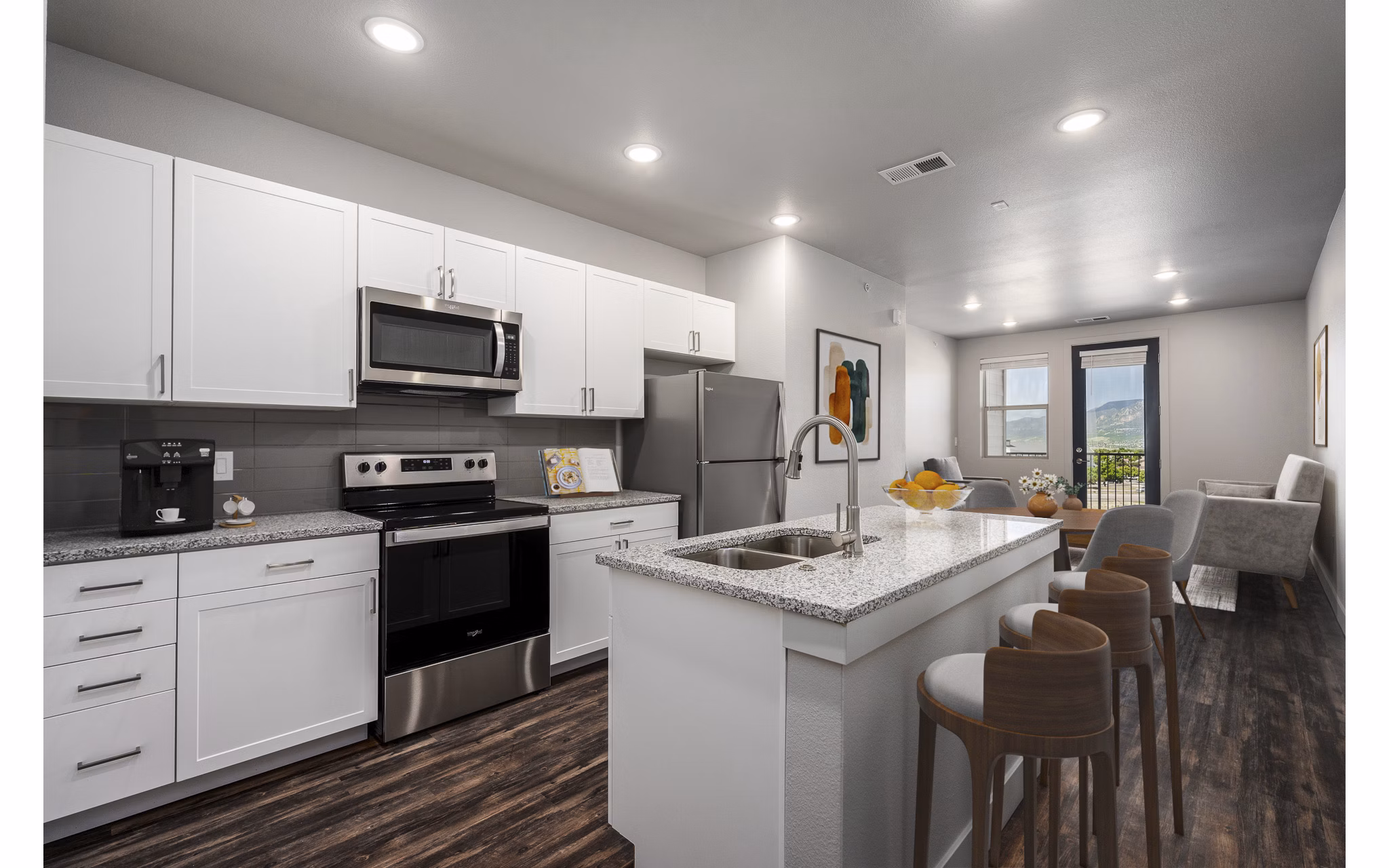 Modern kitchen with stainless steel appliances at The Flats at Aero Park Apartments