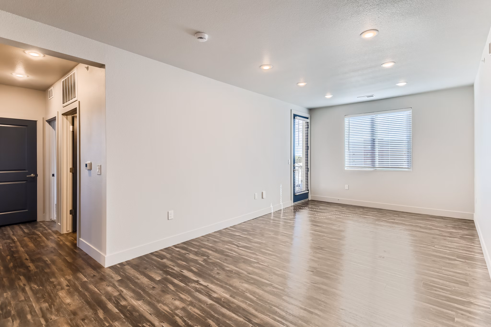 Modern living room with stylish furnishings at The Flats at Aero Park Apartments, offering luxury living and comfort in a contemporary setting