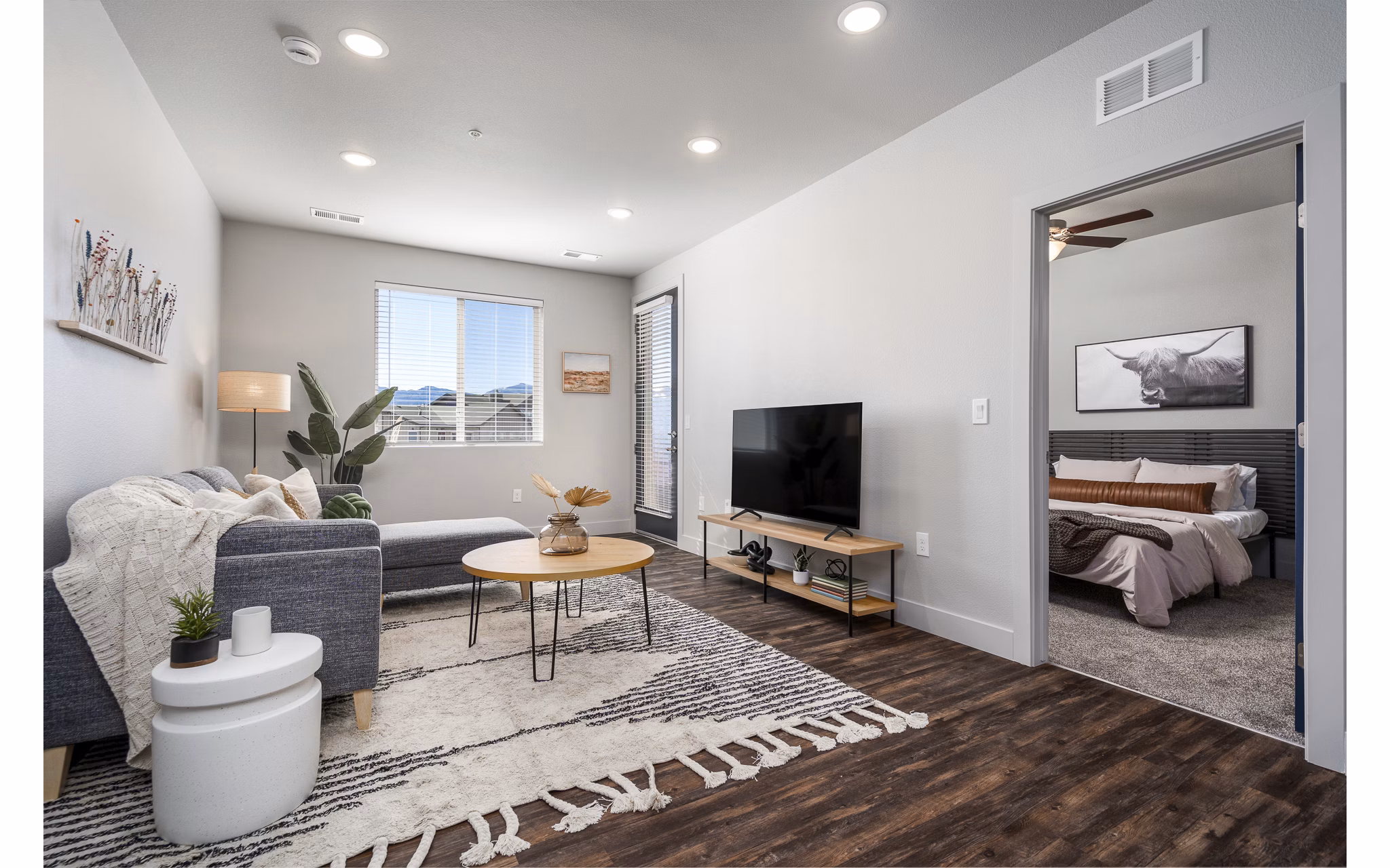 Spacious living room with modern decor at The Flats at Aero Park Apartments