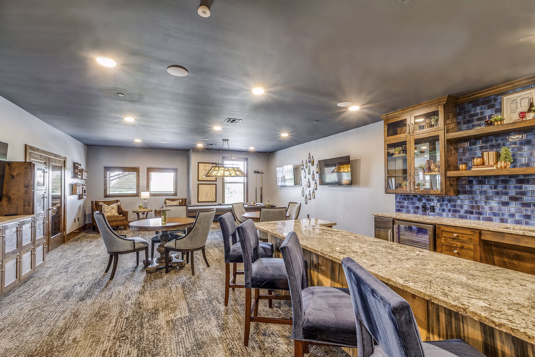 Clubhouse featuring modern furniture and communal spaces at Alders Cross Creek Apartments, a Greystar luxury community