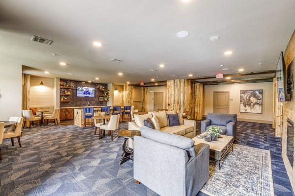 Clubhouse featuring modern design and relaxing seating at Alders Cross Creek Apartments