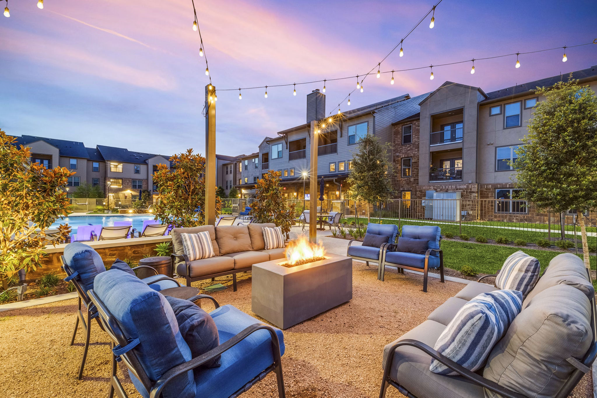 Fire pit on patio at Alders Cross Creek Apartments offers luxury outdoor seating and warmth in elegant surroundings
