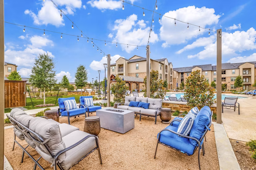 Cozy fire pit on a modern patio at Alders Cross Creek Apartments