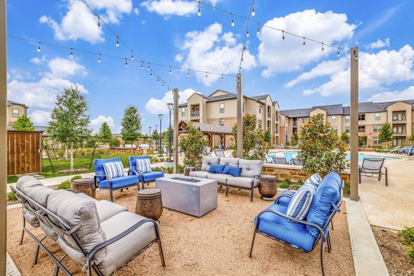 Cozy fire pit on a modern patio at Alders Cross Creek Apartments