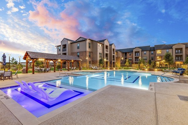 Peaceful poolside oasis at Alders Cross Creek Apartments