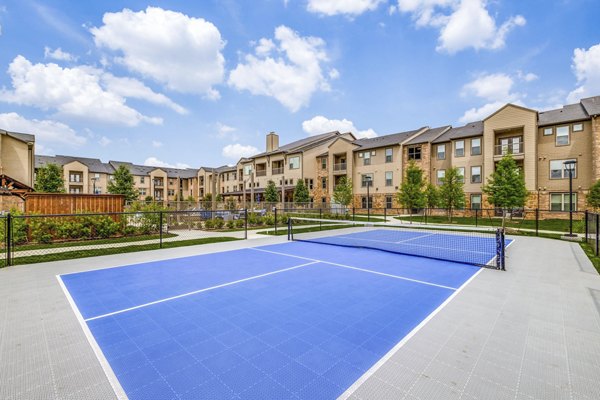 Outdoor sport court at Alders Cross Creek Apartments offering recreational play and fitness activities