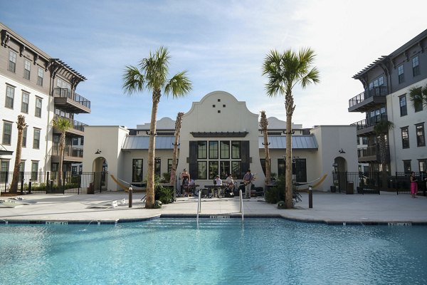 Resort-style pool with lounge chairs at Atlantic Nowell Creek Apartments, perfect for relaxation and leisure