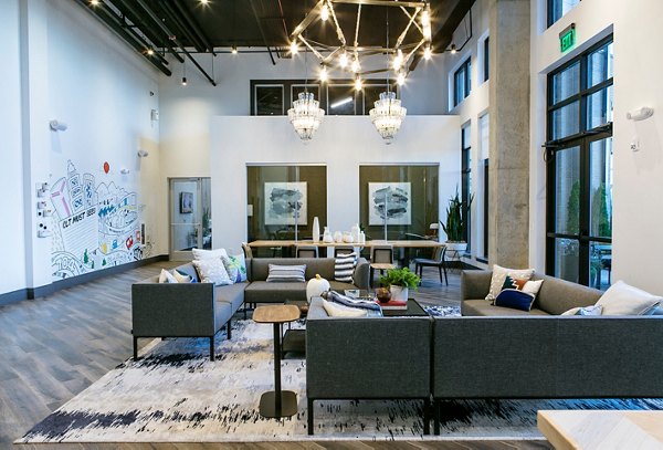 Clubhouse featuring stylish lounge seating and modern dÃ©cor at Bradham at New Bern Apartments