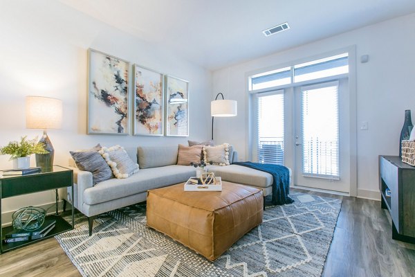 Contemporary living room with stylish decor at Bradham at New Bern Apartments