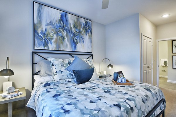 Contemporary bedroom with stylish decor at The Aspens Verdae Apartments