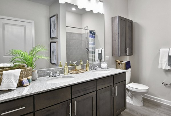 Modern bathroom with marble countertops at The Aspens Verdae Apartments