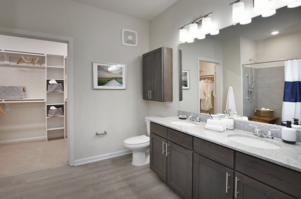 Stylish bathroom with marble countertops at The Aspens Verdae Apartments