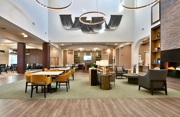 Clubhouse featuring modern design with social spaces at The Aspens Verdae Apartments