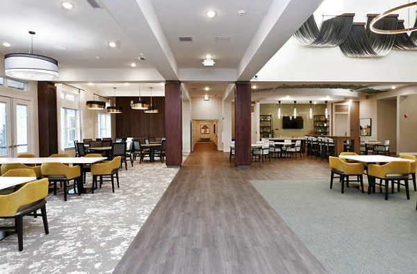 Dining area with stylish furnishings and natural light at The Aspens Verdae Apartments, offering luxury living in a vibrant Greenville community