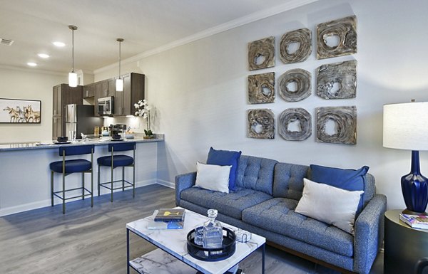Bright living room with modern decor at The Aspens Verdae Apartments