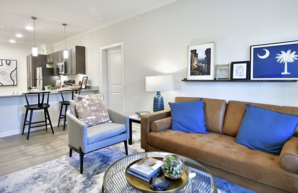 Spacious living room at The Aspens Verdae Apartments featuring modern design and natural light Perfect for luxury living in a premium location