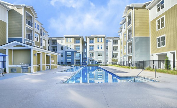 Resort-style swimming pool at The Aspens Verdae Apartments, offering luxury outdoor relaxation spaces