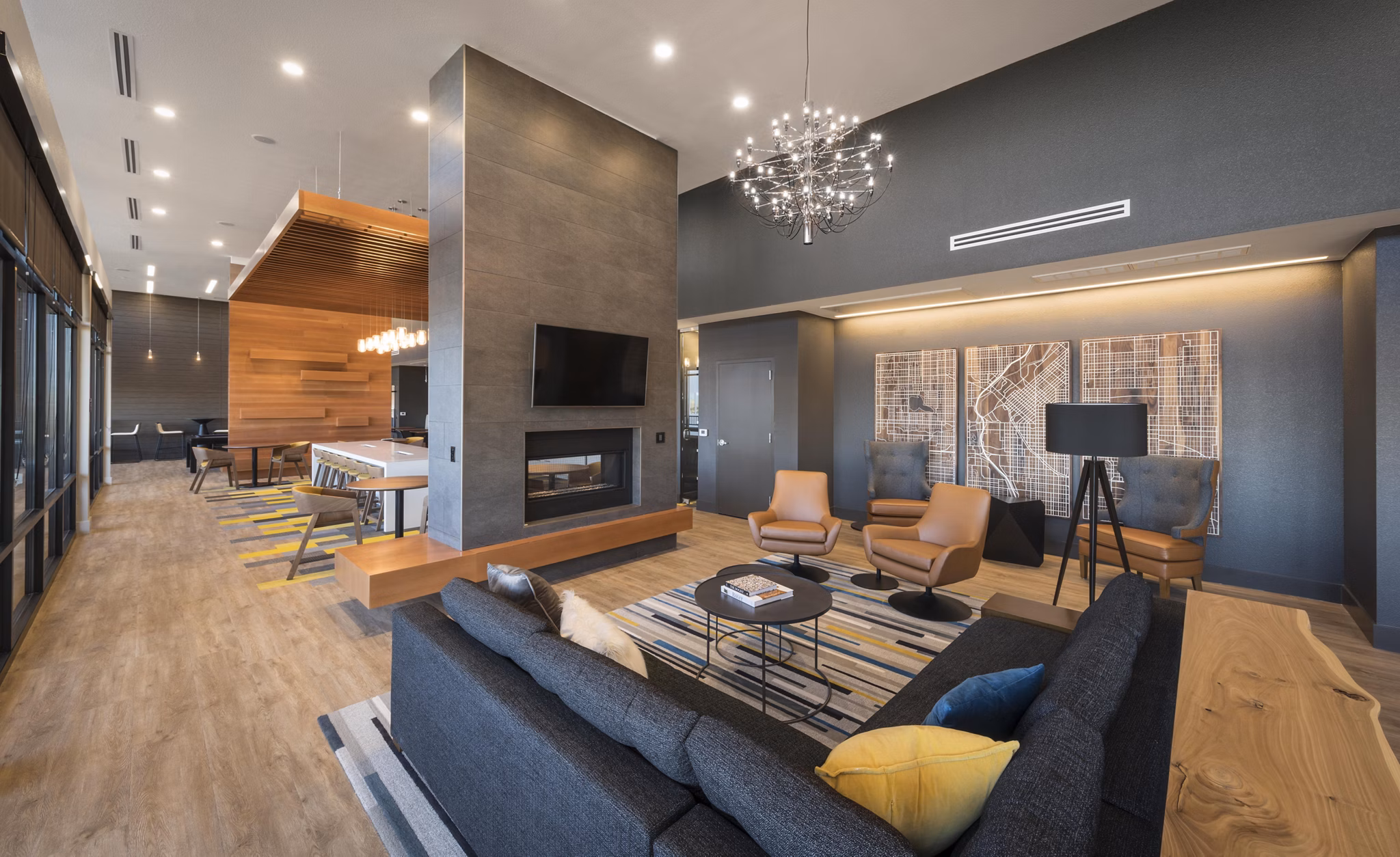 Clubhouse at Beacon 85 Apartments: Modern social space with seating and entertainment areas in luxury Denver community