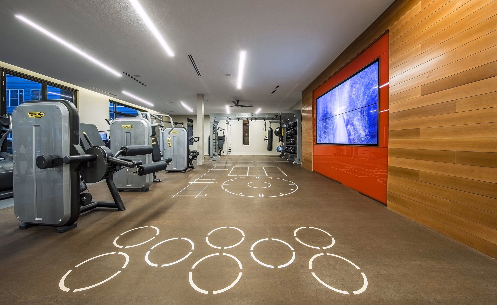 Modern fitness center with advanced workout equipment at Beacon 85 Apartments, a luxury community by Greystar