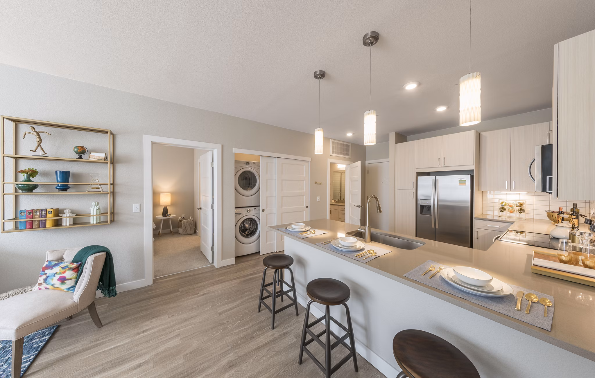 Bright kitchen with granite countertops and stainless steel appliances in Beacon 85 Apartments