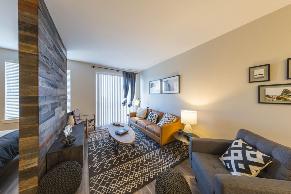 Cozy living room with modern furnishings at Prado Apartments luxury apartments