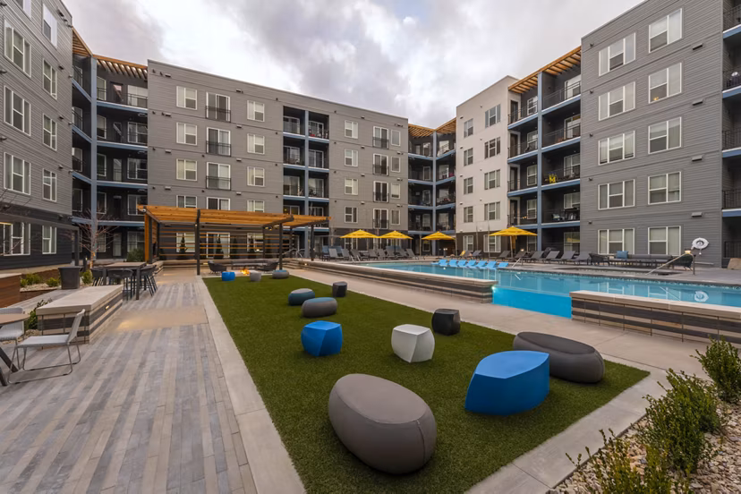 Beacon 85: Tranquil courtyard with modern seating areas at luxury apartments in Denver