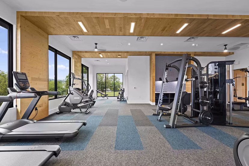 fitness center at Hominy at RiverBlue Apartments