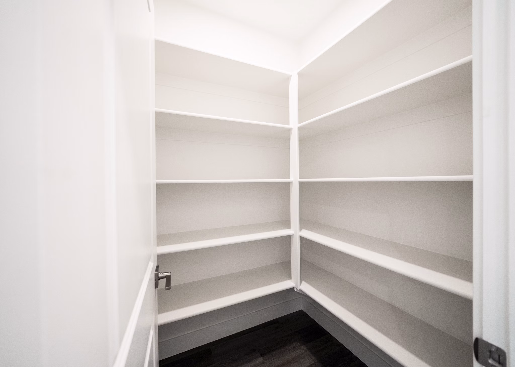 Walk-in closet with custom shelving in Klein Huis at Turner Mill Apartments