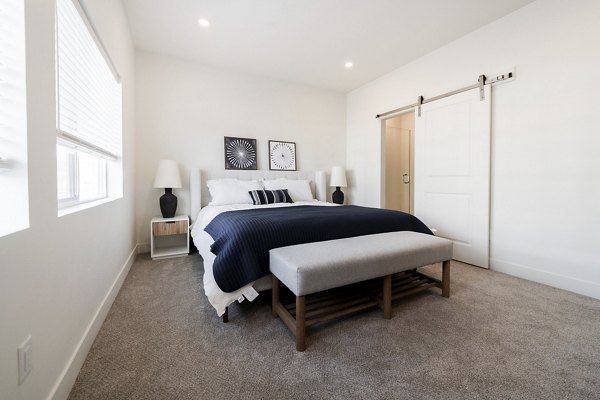 Cozy bedroom with modern decor at Klein Huis, Turner Mill Apartments offering luxury living in a serene neighborhood